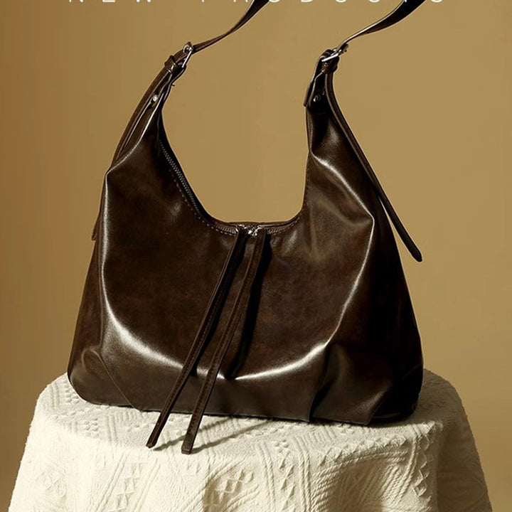 Damen Hobo-Tasche aus hochwertigem Kunstleder mit verstellbarem Schulterriemen und dekorativen Schnürdetails Nord Taschen