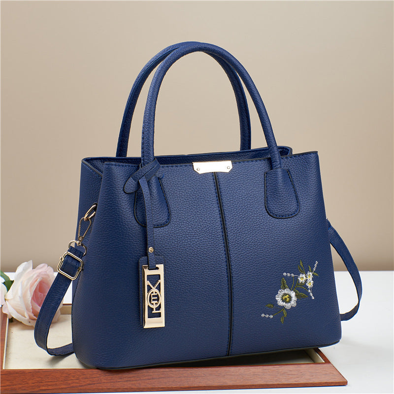 Damen Umhängetasche mit floralem Stickdesign und abnehmbarer Quaste Nord Taschen