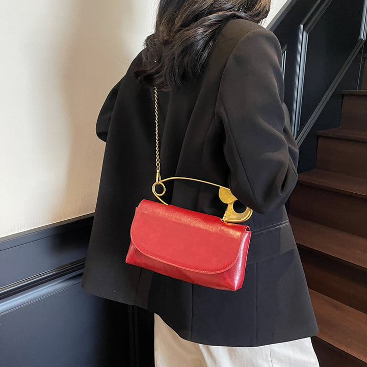 Damen elegante Handtasche mit künstlerischem Metallgriff Nord Taschen