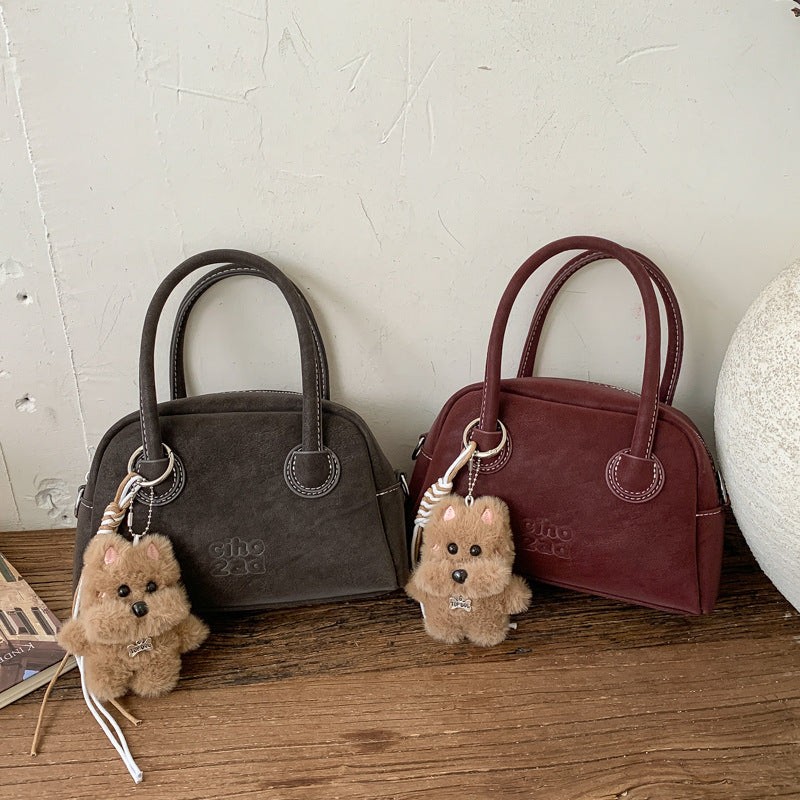 Damen-Handtasche mit verspieltem Tieranhänger Nord Taschen