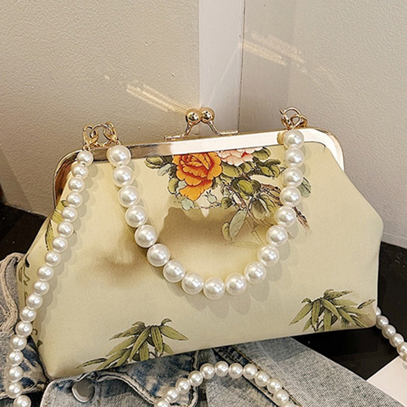Damen elegante Handtasche mit zartem Blumendruck und Perlenkette Nord Taschen