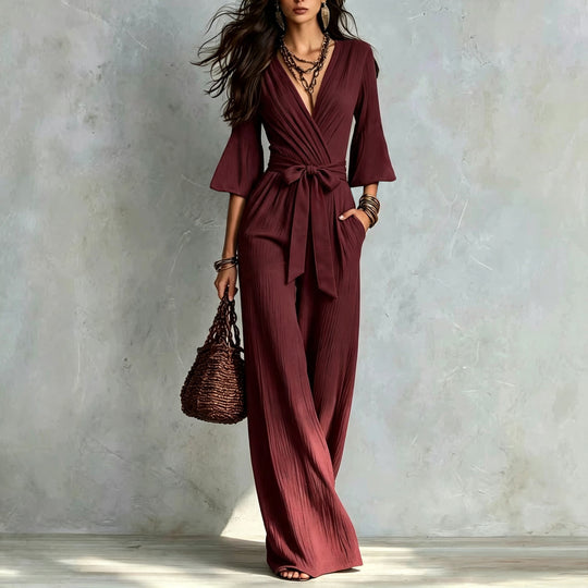 Damen Jumpsuit Wickel-Optik mit weitem Bein, Taillengürtel und Glockenärmeln Nord Taschen