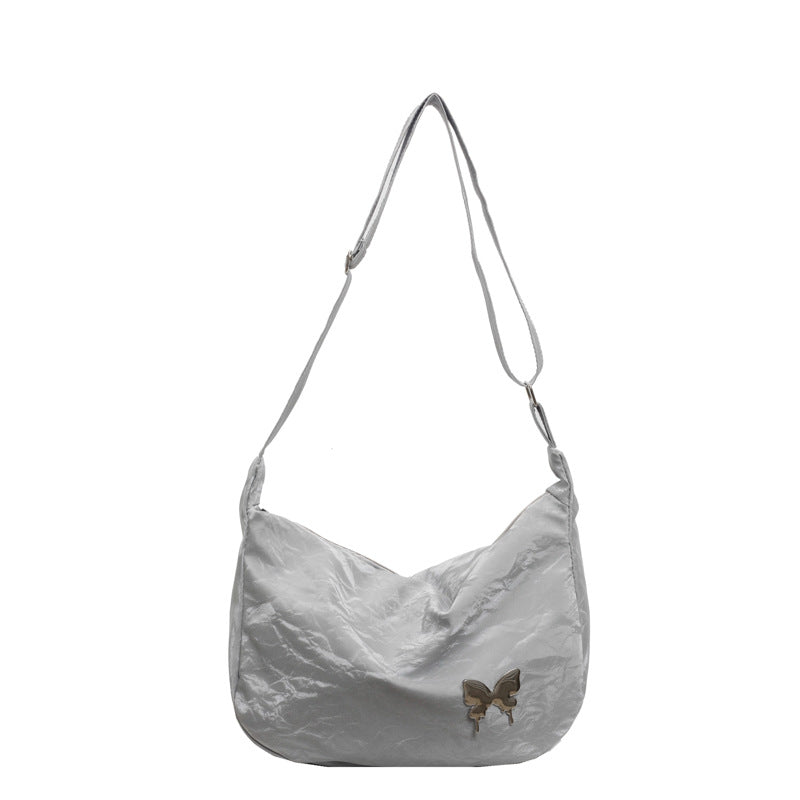 Damen Umhängetasche aus leichtem Material mit dekorativem Schmetterlingsdetail Nord Taschen