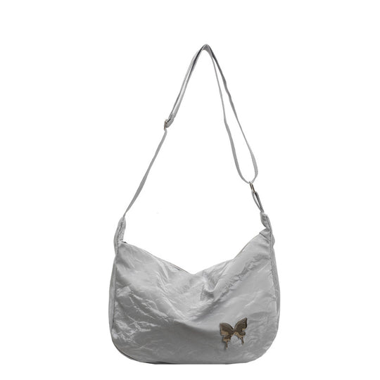 Damen Umhängetasche aus leichtem Material mit dekorativem Schmetterlingsdetail Nord Taschen