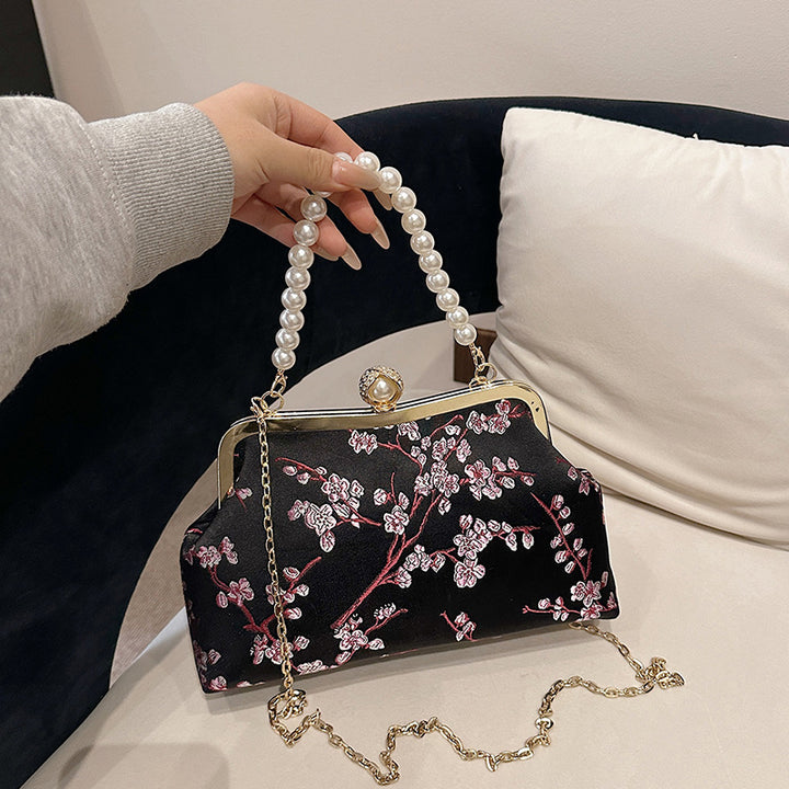 Damen elegante Clutch mit floralen Akzenten Nord Taschen