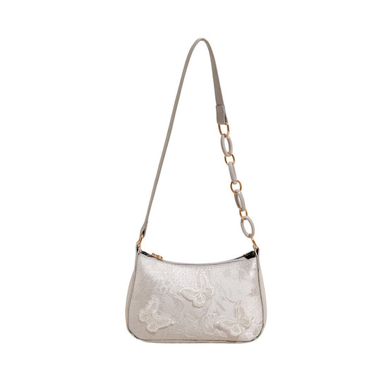 Damen Handtasche mit handgearbeitetem Blumenmuster und modischem Kettenriemen Nord Taschen