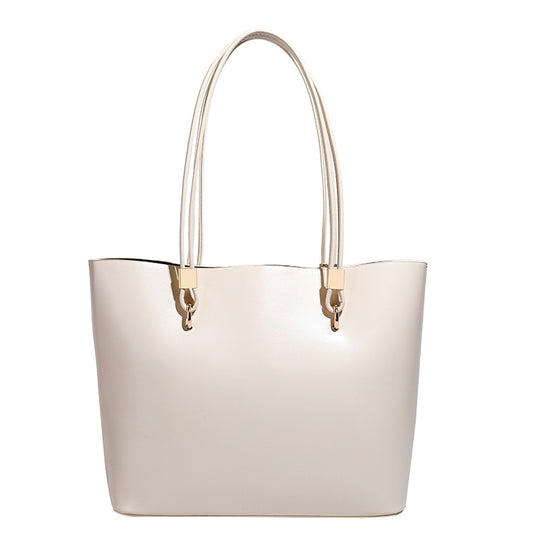 Damen Elegante Handtasche mit hochglänzender Oberfläche und goldenen Details Nord Taschen