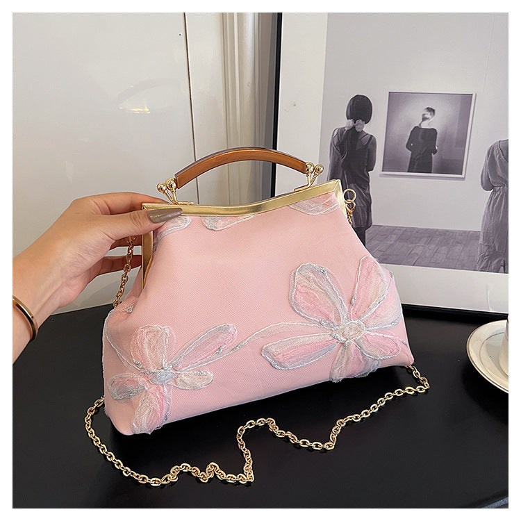 Damen Handtasche mit floralem Muster und elegantem Kettenakkzent Nord Taschen