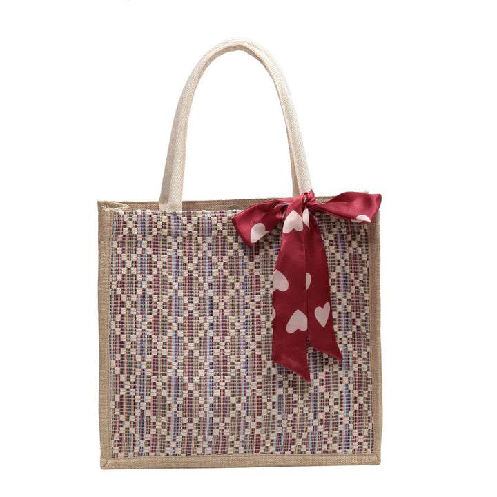 Damen Jute-Einkaufstasche mit buntem Grafikdesign und dekorativem Schleifenakzent Nord Taschen