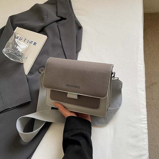 Damen Umhängetasche mit innovativem Klappverschluss und hochwertigen Akzenten Nord Taschen