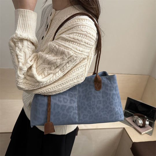 Damen elegante Umhängetasche mit animalischem Muster und praktischen Details Nord Taschen
