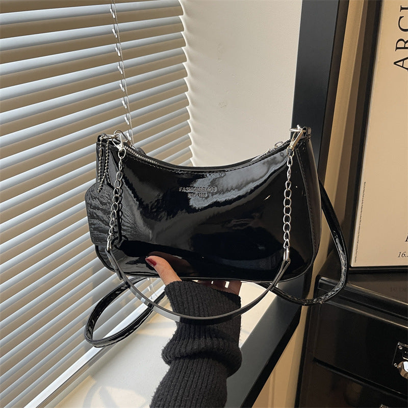 Damen elegante Umhängetasche mit glänzender Lackoberfläche Nord Taschen
