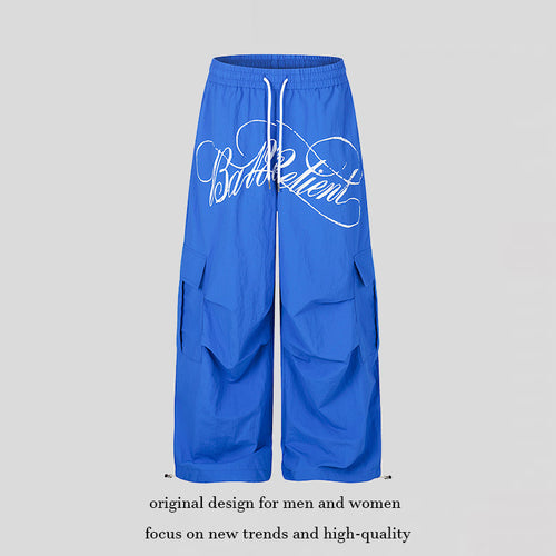 Damen Weite Palazzo-Cargohose mit elastischem Tunnelzugbund, großen Klappentaschen und Statement-Schriftprint Nord Taschen