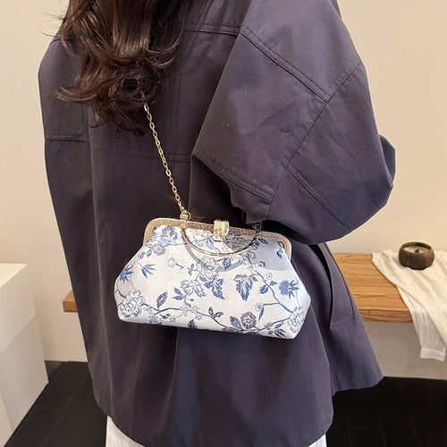 Damen stilvolle Handtasche mit floralem Design und goldfarbenen Akzenten Nord Taschen