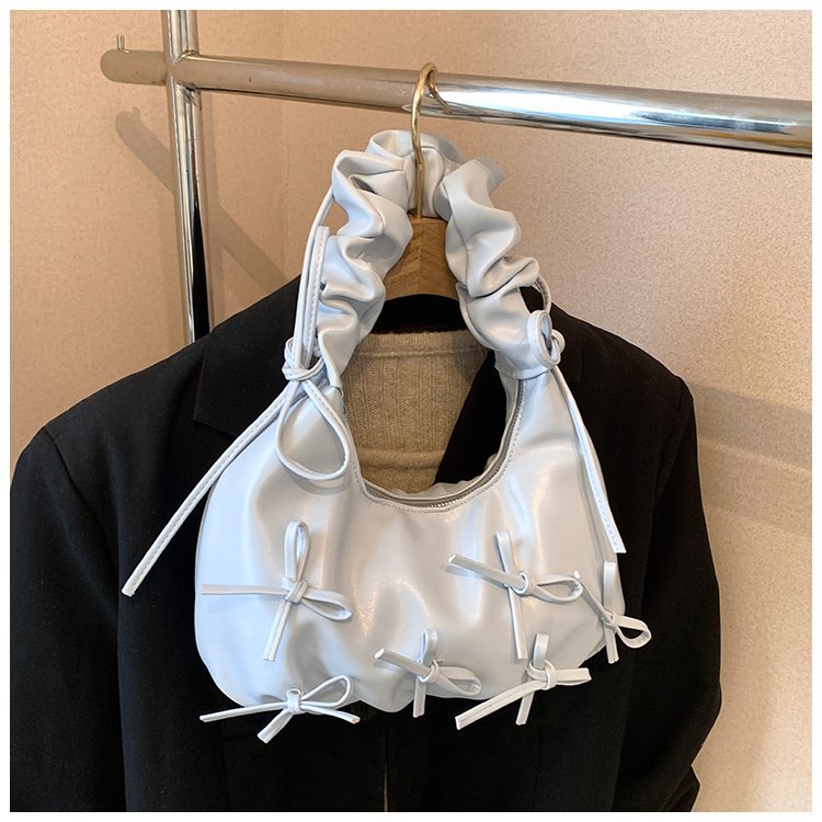 Damen Handtasche mit raffinierten Schleifen-Details und elegantem Tragegriff Nord Taschen