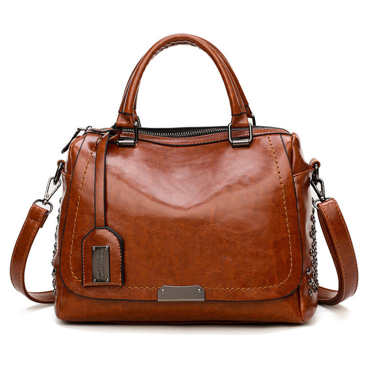 Damen Handtasche mit modischen Nieten und praktischem Schultergurt Nord Taschen
