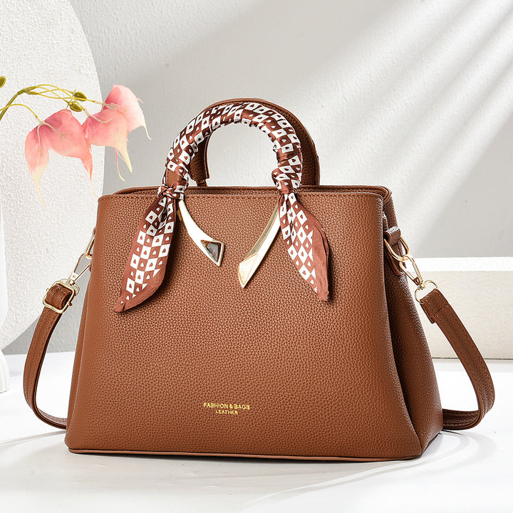 Damen elegante Handtasche mit dekorativer Schal-Applikation Nord Taschen
