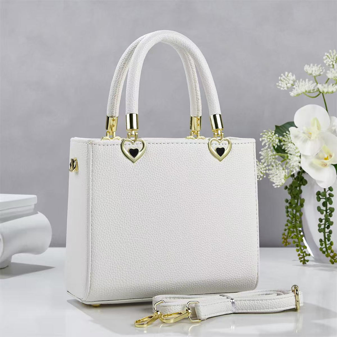 Damen stylische Handtasche mit schimmernden Herzanhängern Nord Taschen