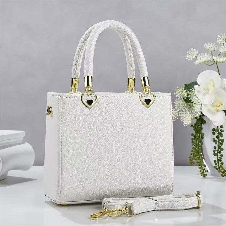 Damen stylische Handtasche mit schimmernden Herzanhängern Nord Taschen