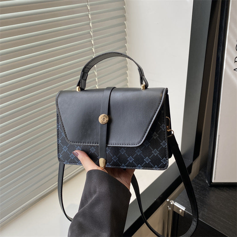 Damen Umhängetasche mit modernem Klappenverschluss und praktischem Handgriff Nord Taschen