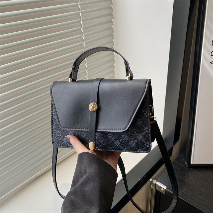 Damen Umhängetasche mit modernem Klappenverschluss und praktischem Handgriff Nord Taschen