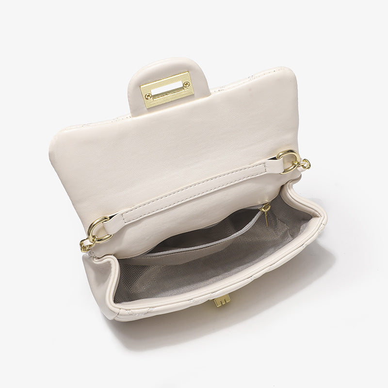 Damen elegante Schultertasche mit stilvoller Steppung und markanten Metallakzenten Nord Taschen