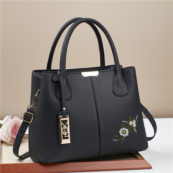 Damen Umhängetasche mit floralem Stickdesign und abnehmbarer Quaste Nord Taschen