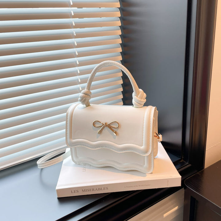 Damen elegante Handtasche mit Wellenstruktur und Schleifendetail Nord Taschen