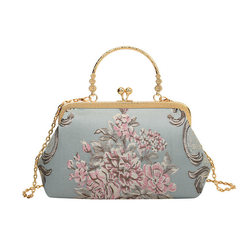 Damen Clutch-Tasche mit floralem Design und goldenen Akzenten Nord Taschen
