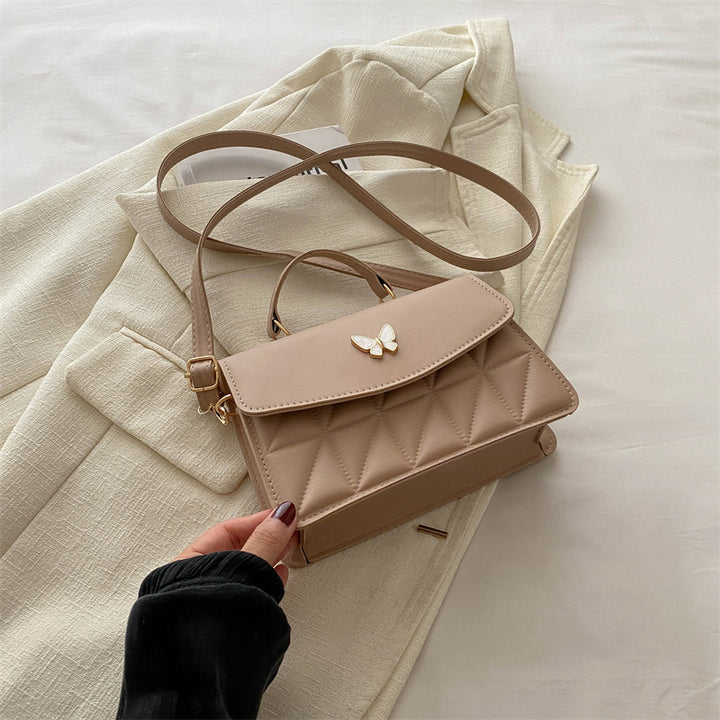 Damen elegante Handtasche mit Quermuster und stylischem Schmetterling Nord Taschen