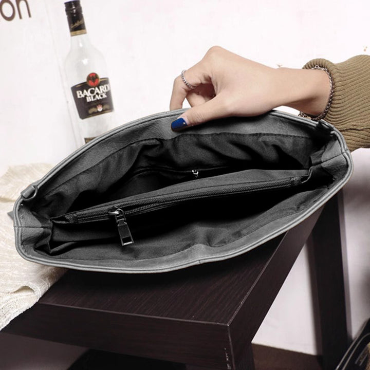 Damen Clutch mit innovativem Riemen-Design Nord Taschen
