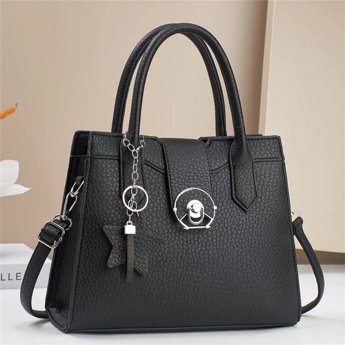 Damen elegante Handtasche mit modischem Anhänger Nord Taschen