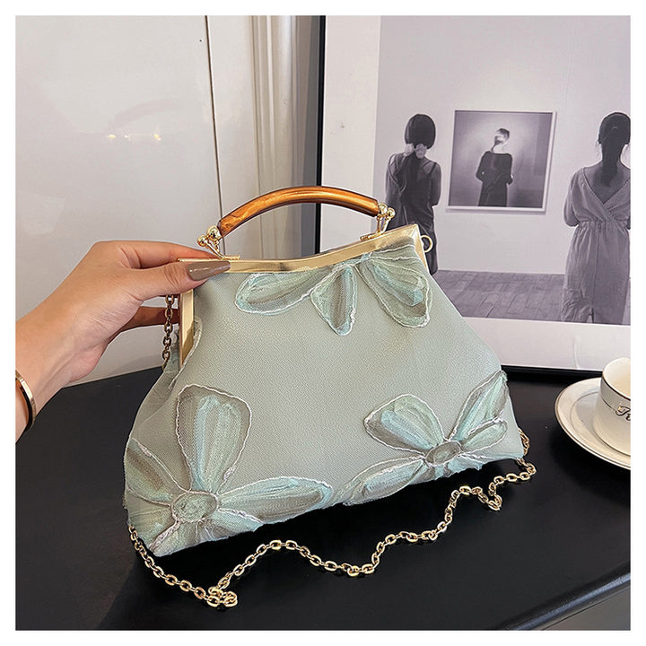 Damen Handtasche mit floralem Muster und elegantem Kettenakkzent Nord Taschen