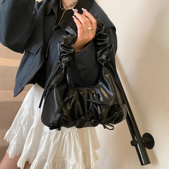 Damen Handtasche mit raffinierten Schleifen-Details und elegantem Tragegriff Nord Taschen