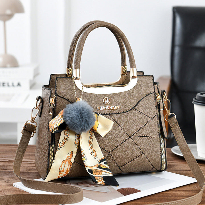 Damen elegante Handtasche mit abnehmbarem Schleifen-Anhänger Nord Taschen