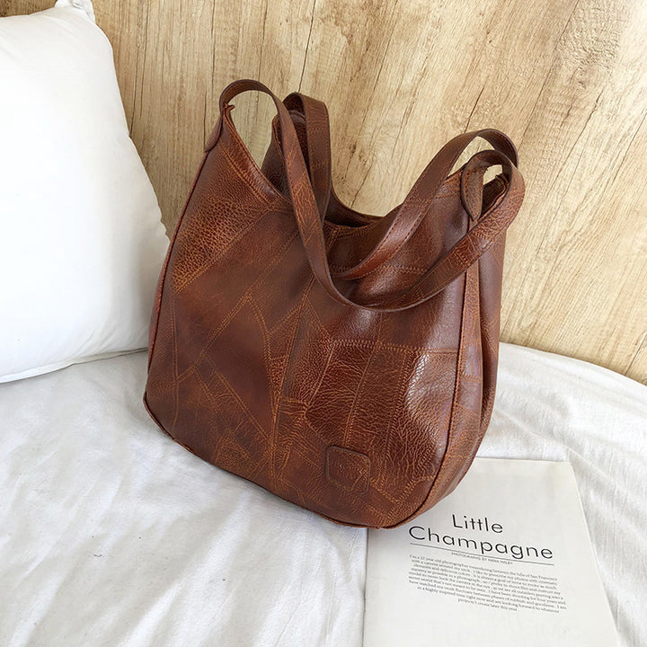 Damen Handtasche mit geschwungenem Design und hochwertiger Lederstruktur Nord Taschen