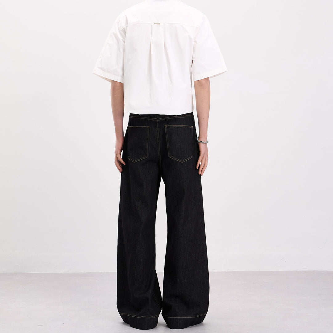 Herren Oversize-Denim-Palazzohose mit skulpturalen Paneelnähten und tiefem Schritt Nord Taschen
