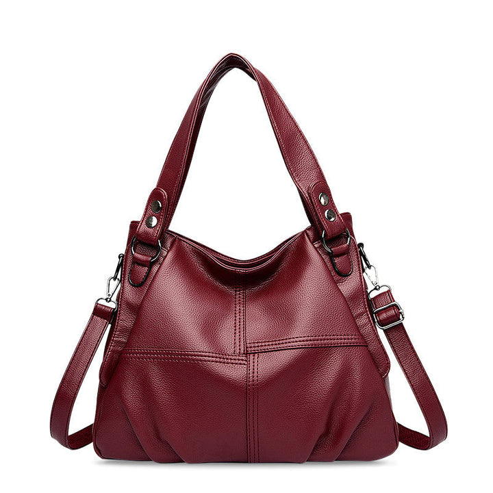 Nord Taschen | Große vegane Kuhfell-Hobo-Schultertasche