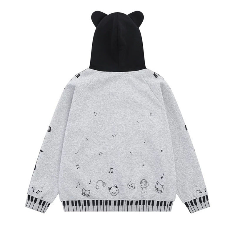 Damen Kapuzensweatjacke mit durchgehendem Reißverschluss, Musikprint, Klaviertasten‑Bündchen und Ohrenkapuze Nord Taschen