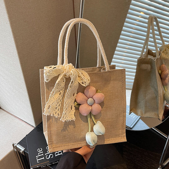 Damen Jute-Handtasche mit floralen Applikationen und dekorativem Schleifen-Design Nord Taschen