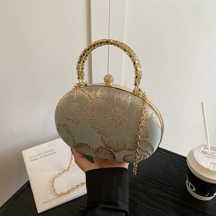 Damen Clutch mit floralem Muster und goldenen Akzenten Nord Taschen