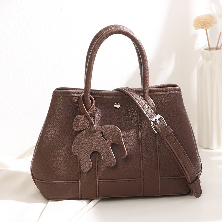 Damen Handtasche mit abnehmbarem Elefantenanhänger und elegantem Kunstleder Nord Taschen