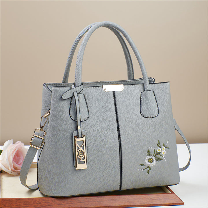 Damen Umhängetasche mit floralem Stickdesign und abnehmbarer Quaste Nord Taschen