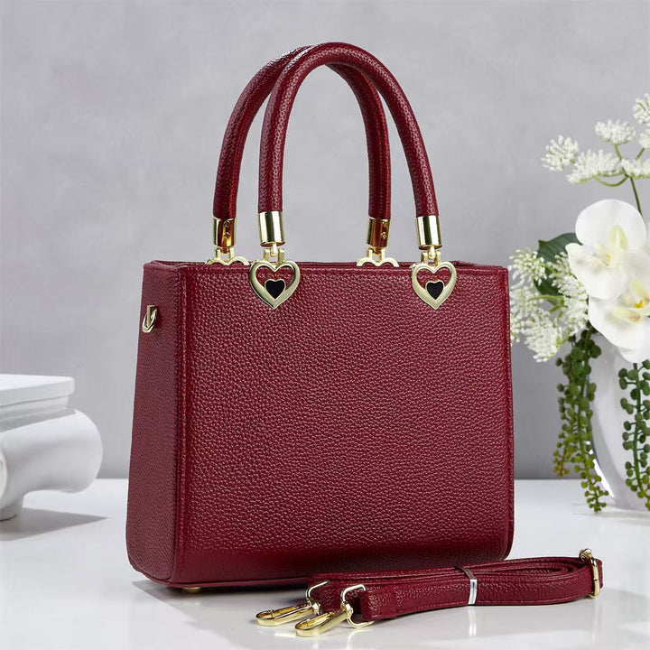 Damen stylische Handtasche mit schimmernden Herzanhängern Nord Taschen