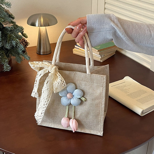Damen Jute-Handtasche mit floralen Applikationen und dekorativem Schleifen-Design Nord Taschen