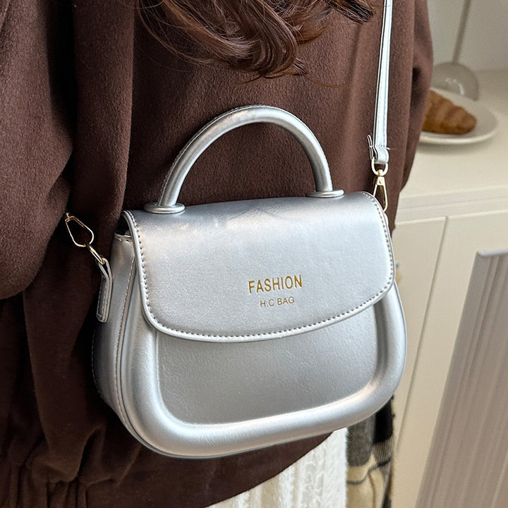 Damen Henkeltasche mit modernem Klappverschluss und eleganten Details Nord Taschen