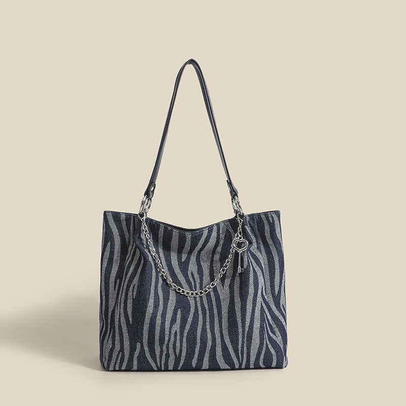 Damen Tote-Tasche mit stylischem Zebra-Muster und elegantem Kettenakzent Nord Taschen