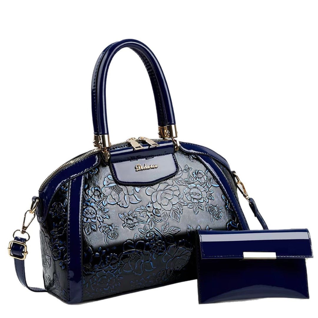 Damen modische Handtasche mit floralen Prägungen und Glanz-Akzenten Nord Taschen