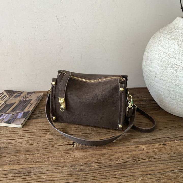 Damen Umhängetasche aus hochwertigem Kunstleder mit innovativem Faltendesign Nord Taschen