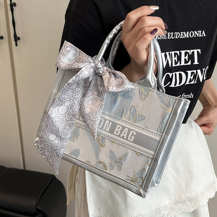 Damen Mini-Henkeltasche mit einzigartigem floralem Design und elegantem Schleifenakzent Nord Taschen